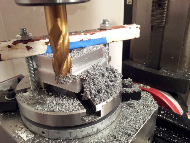 Aluminum block being milled